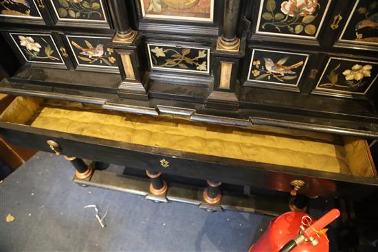 A 17th/18th century Italian and later pietra dura and ebony veneered cabinet on an ebonised wood stand, W.4ft 2in. D.1ft 7in. H.4ft 6.5